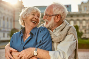 Senior couple learning how to avoid a dental implant scam